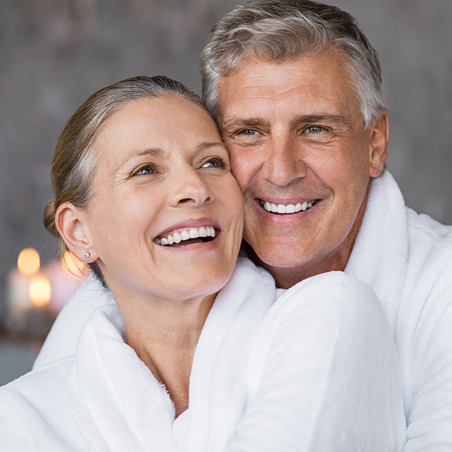 woman smiling with partner after hormone therapy for women in Naperville, IL