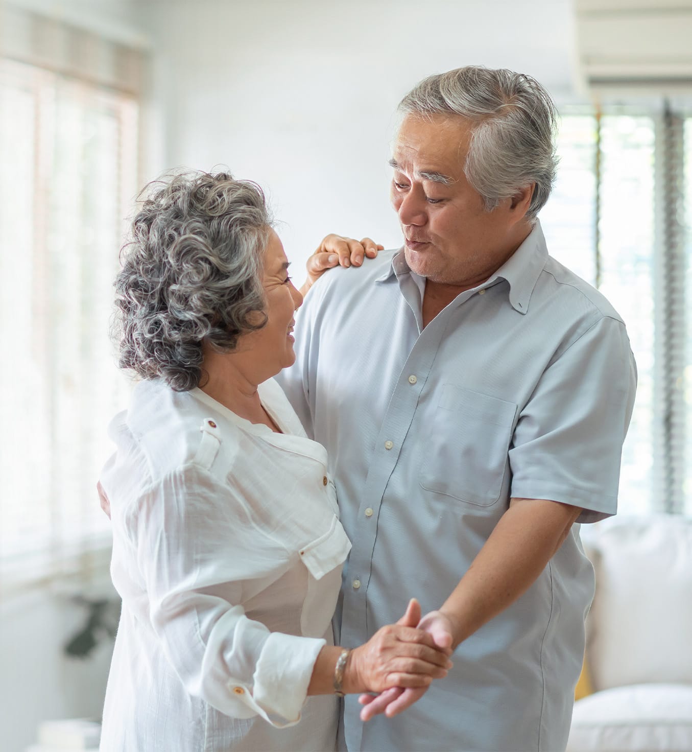Middle-aged couple dancing together
