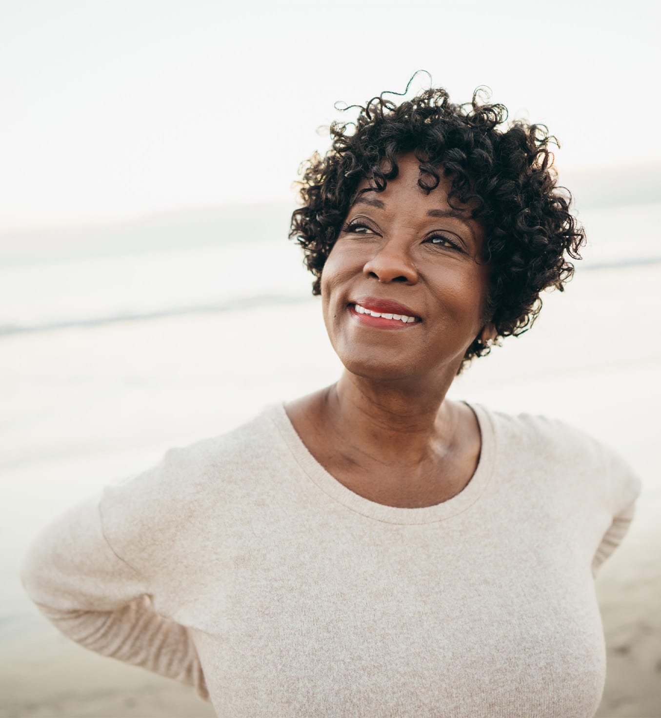 Woman with curly hair smilling