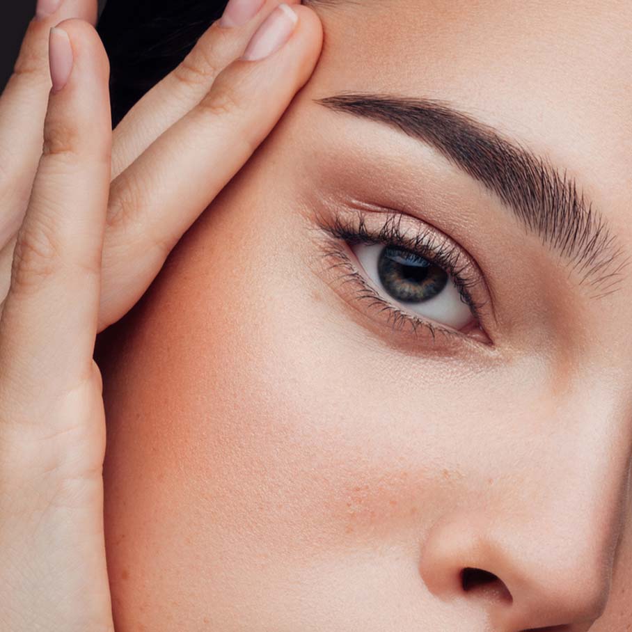 Woman's clear skin after red light therapy from Serotonin Centers.