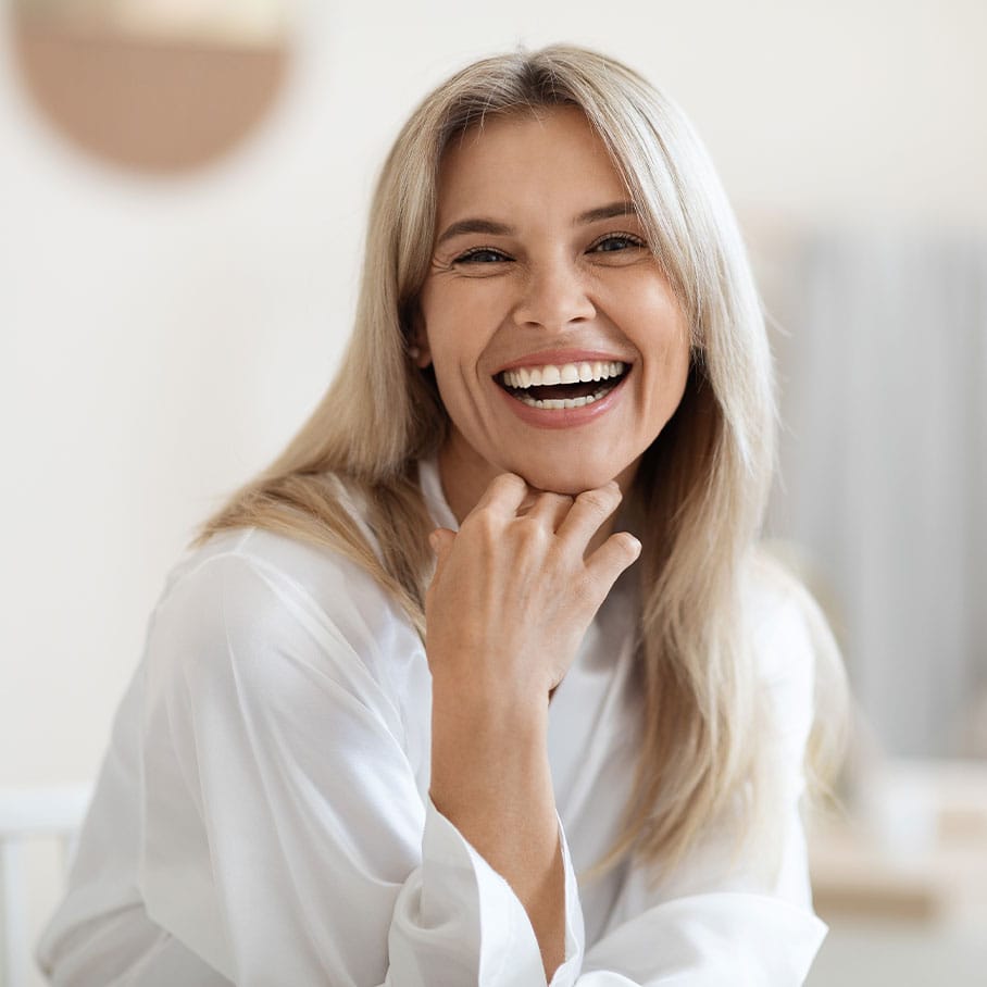 woman smiling after dermal fillers in Naperville, IL