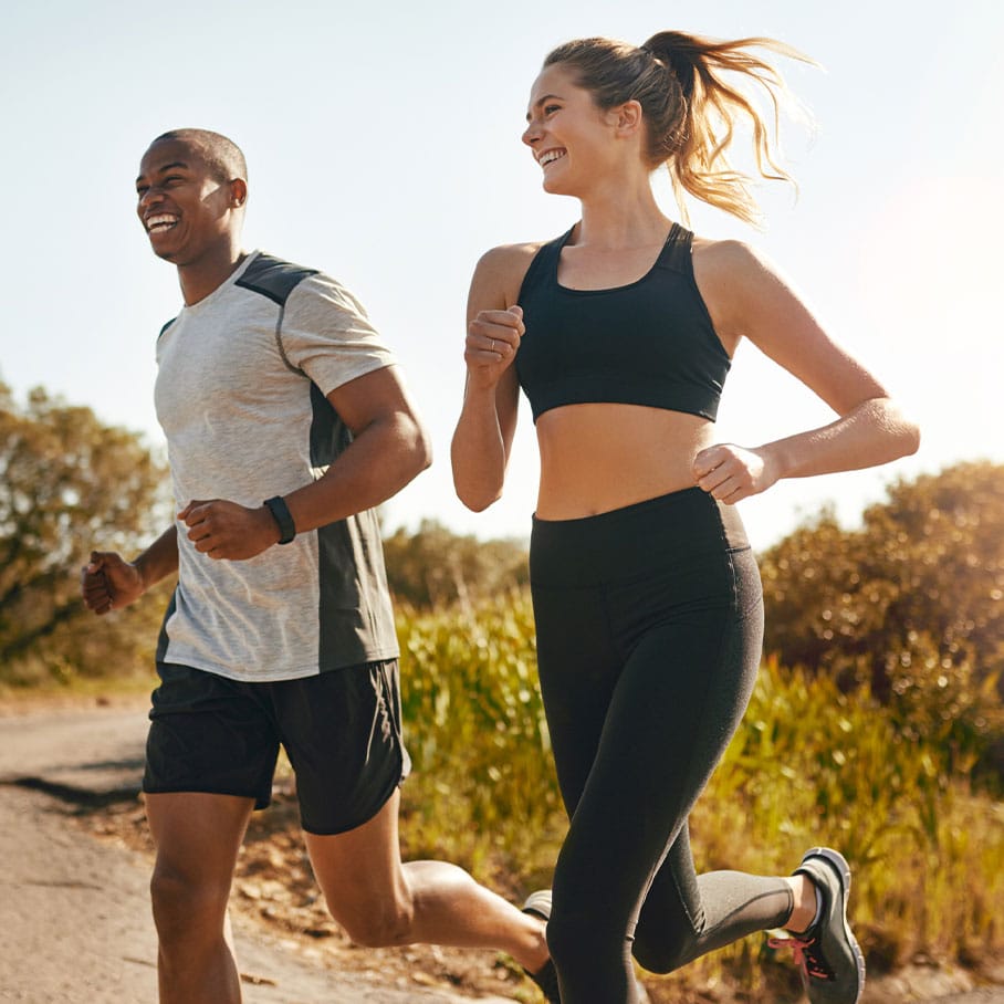 Happy couple jogging after hormone therapy from Serotonin Centers.