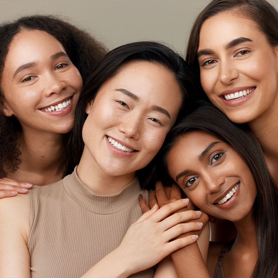 Four happy women with nice skin after receiving Botox from Serotonin Centers.