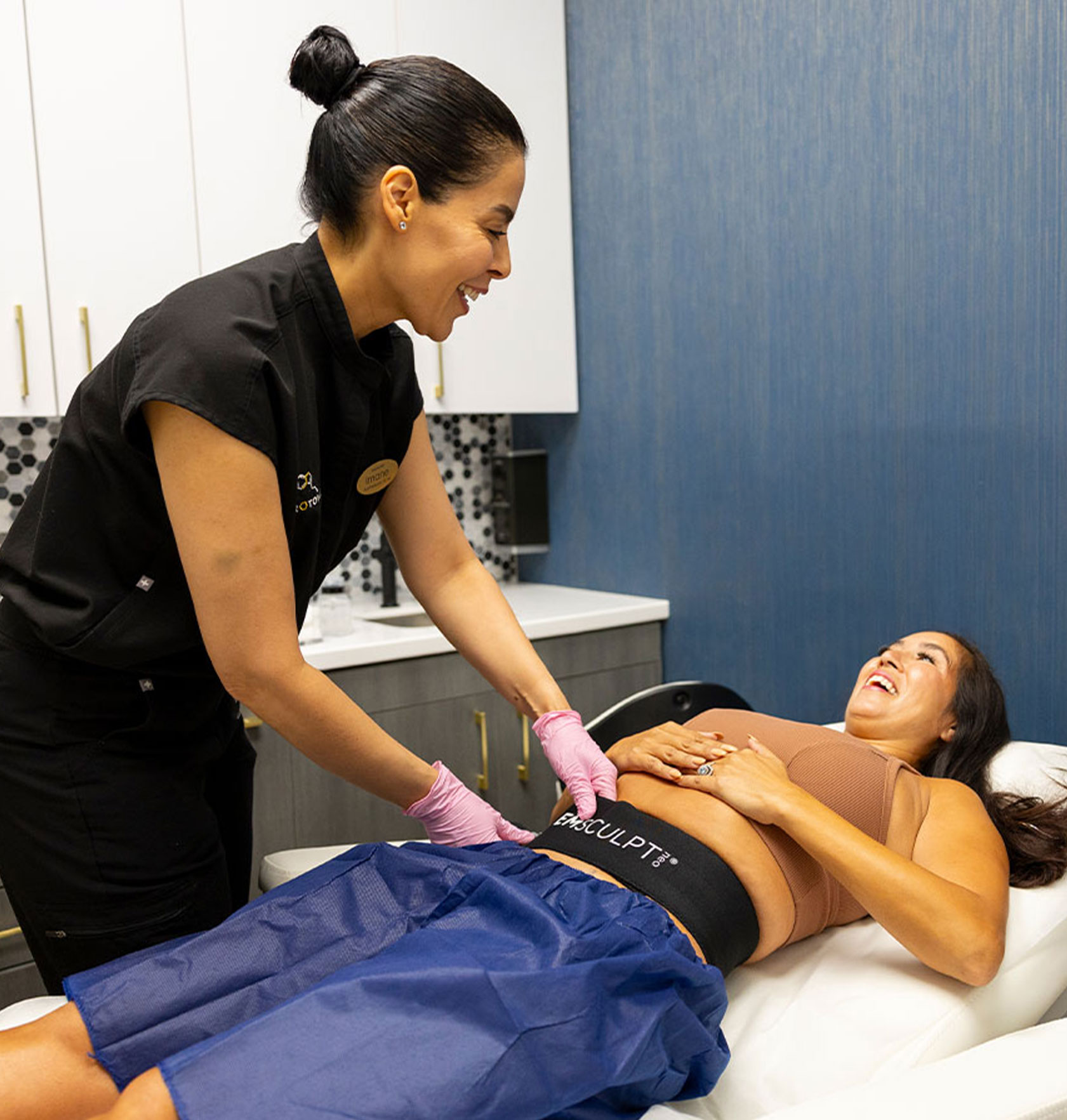 woman receiving Emsculpt med spa treatment by Serotonin Centers team member in Lake Nona, FL