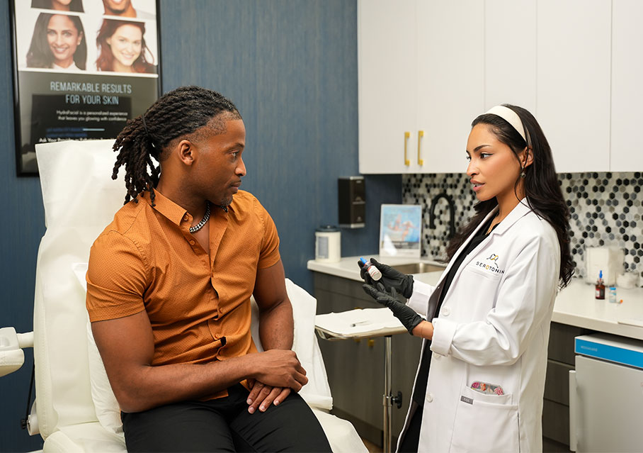 Patient discussing NAD+ therapy with Serotonin Centers team member in Fort Worth, TX