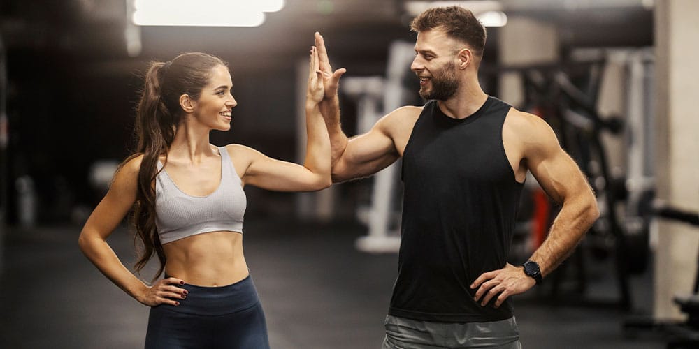 couple working out together to increase their muscle development