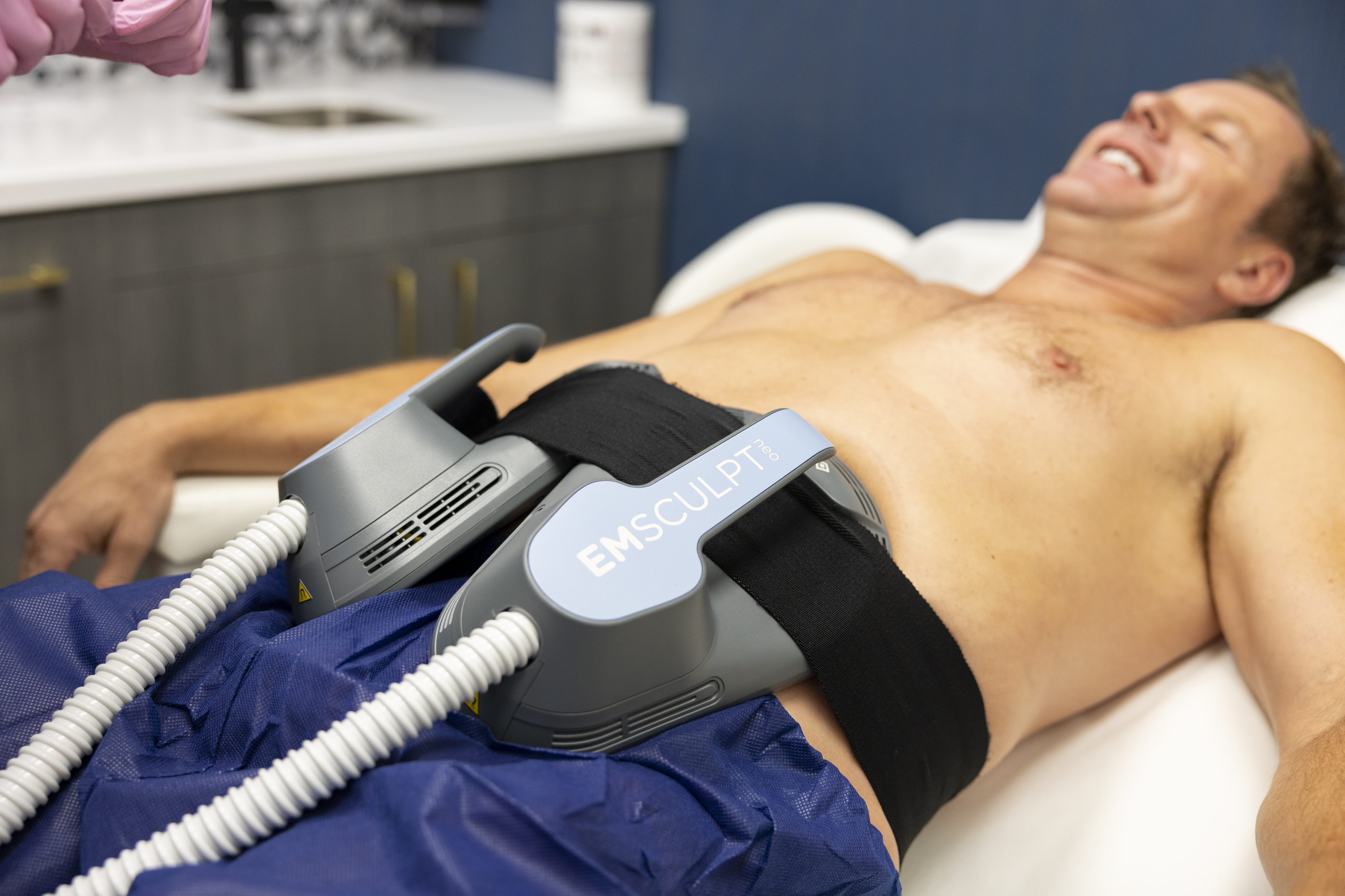man receiving EMSCULPT NEO treatment in Fort Worth, TX